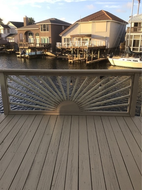 wooden deck featuring a boat dock