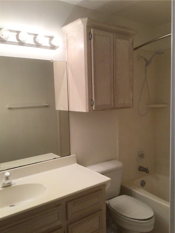 full bathroom featuring vanity, toilet, and shower / bath combination