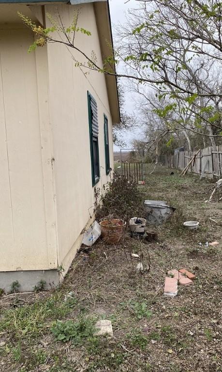 view of home's exterior with fence