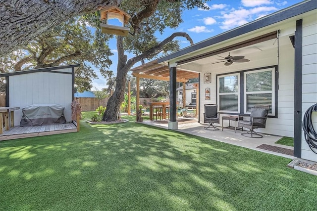 view of yard featuring ceiling fan