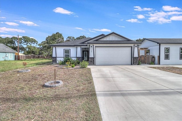 view of front facade featuring a front yard and a garage