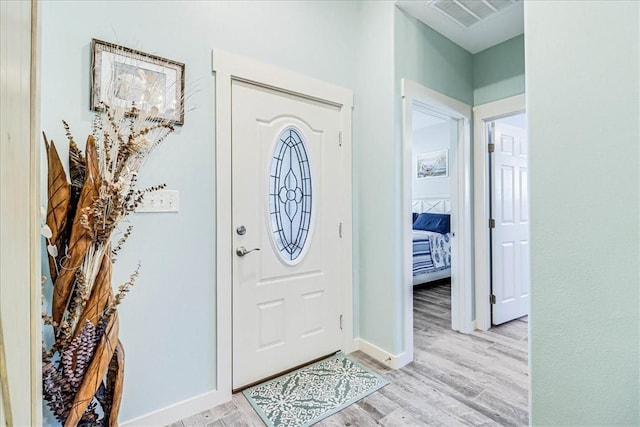 entryway with light hardwood / wood-style flooring