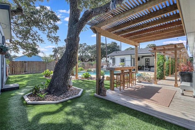 view of yard with a pergola and a swimming pool side deck