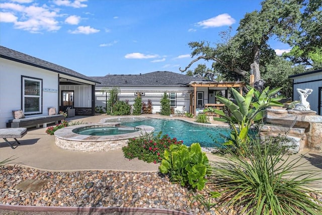 view of pool featuring an in ground hot tub and a patio