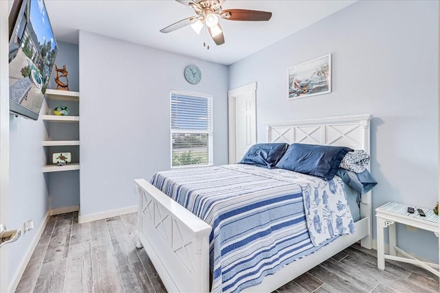 bedroom with ceiling fan and hardwood / wood-style floors