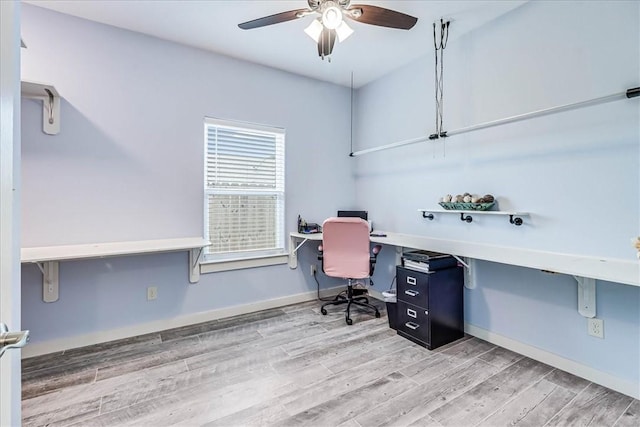 office with ceiling fan and hardwood / wood-style floors