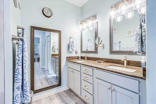 bathroom featuring hardwood / wood-style flooring and vanity