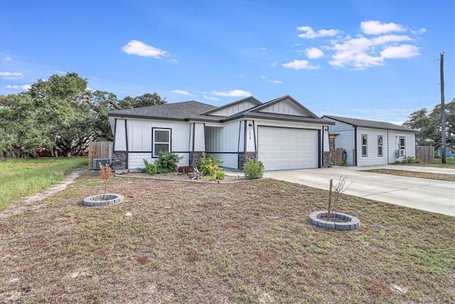 view of front of house featuring a garage and a front lawn