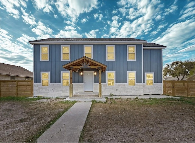 1101 6th St, Corpus Christi, TX 78404 - view of front of house featuring board and batten siding and stone siding