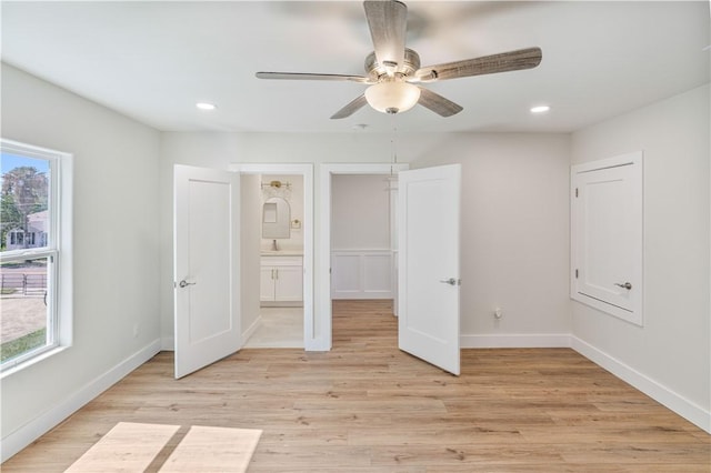1101 6th St, Corpus Christi, TX 78404 - unfurnished bedroom featuring multiple windows, light wood-style flooring, recessed lighting, and a ceiling fan