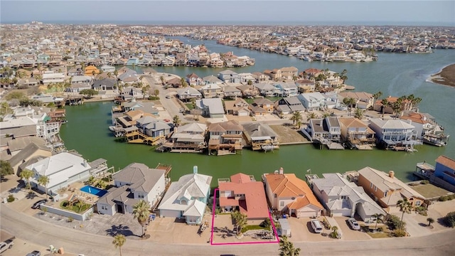 birds eye view of property featuring a water view and a residential view