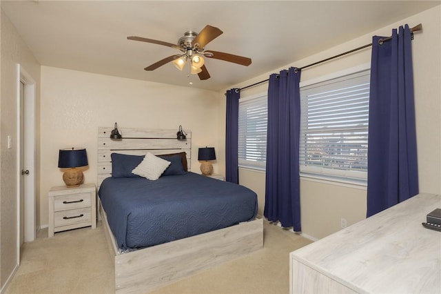 bedroom featuring ceiling fan, carpet floors, and baseboards