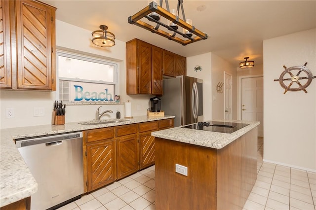 kitchen featuring stainless steel appliances, a center island, light tile patterned flooring, and a sink