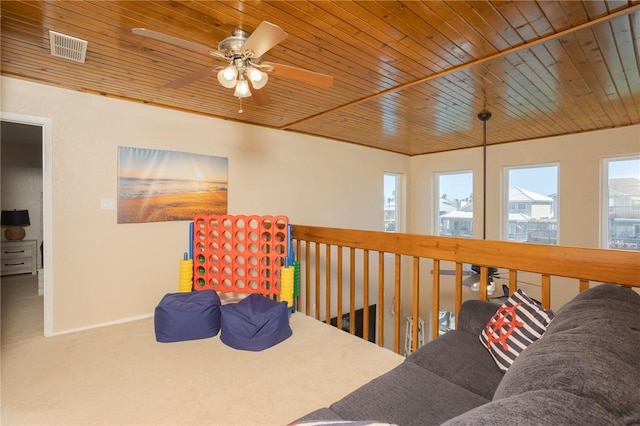 interior space with carpet, wood ceiling, visible vents, and baseboards