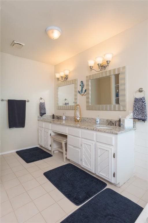 bathroom featuring double vanity, tile patterned flooring, a sink, and visible vents