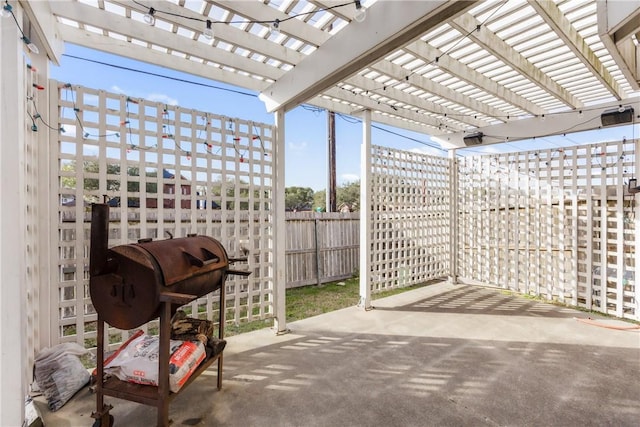 view of patio / terrace with a fenced backyard and a pergola