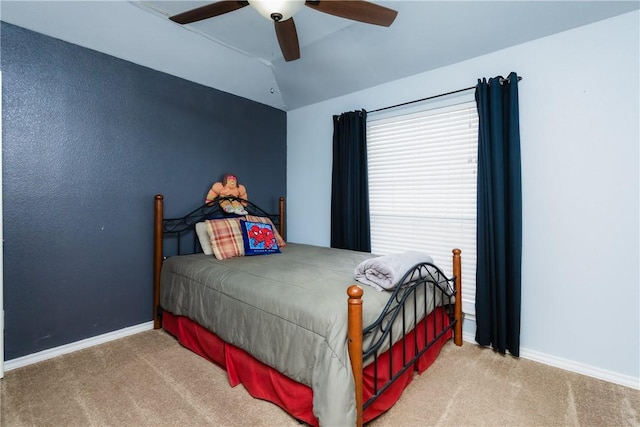 bedroom featuring vaulted ceiling, carpet flooring, a ceiling fan, and baseboards