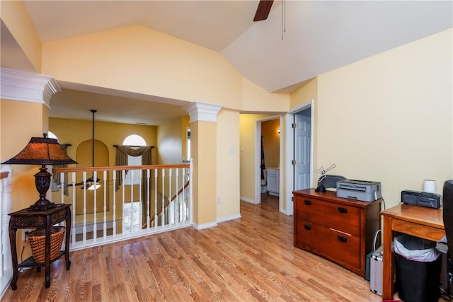 office with baseboards, lofted ceiling, a ceiling fan, and light wood finished floors