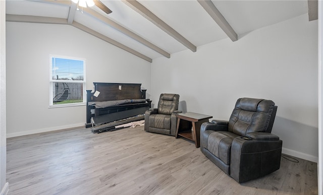 sitting room with lofted ceiling with beams, light hardwood / wood-style floors, and ceiling fan