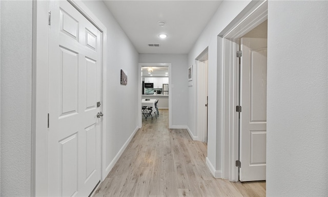 hall featuring light hardwood / wood-style floors