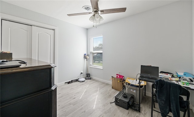 office with ceiling fan and light hardwood / wood-style floors