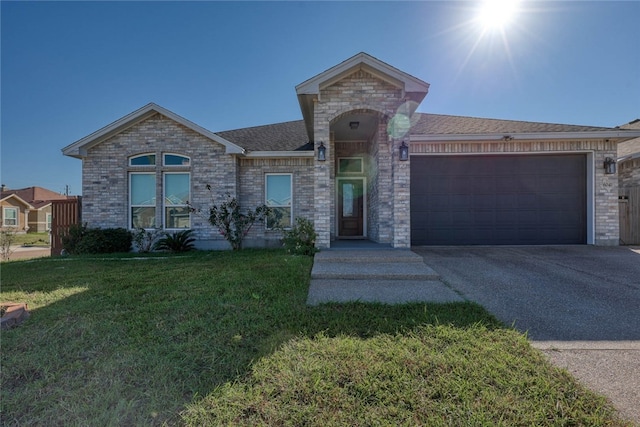 view of front of house with a front lawn and a garage