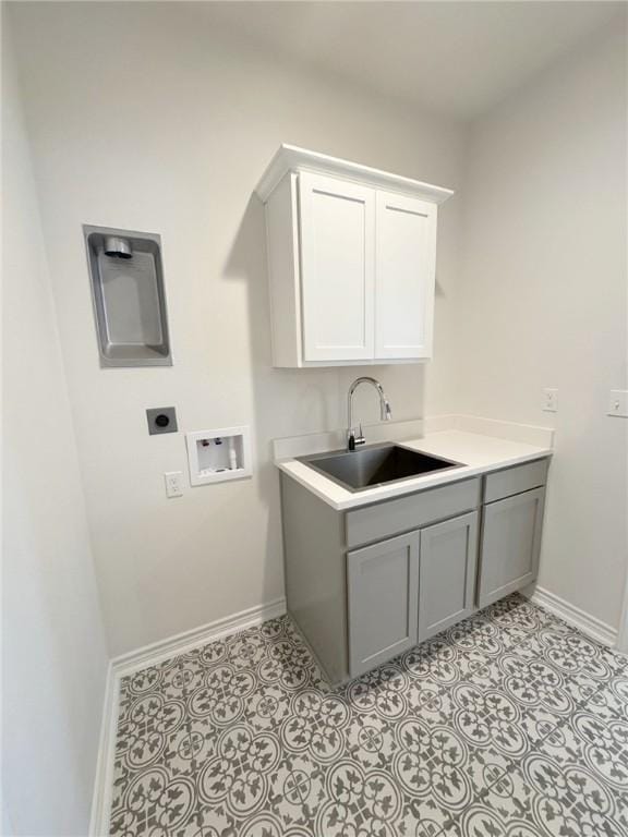 2550 Las Estrellas St, Corpus Christi, TX 78414 - laundry area with electric dryer hookup, baseboards, washer hookup, and cabinet space