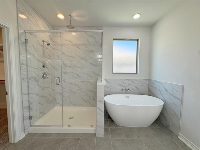 2550 Las Estrellas St, Corpus Christi, TX 78414 - bathroom with a marble finish shower, a freestanding bath, and tile patterned floors