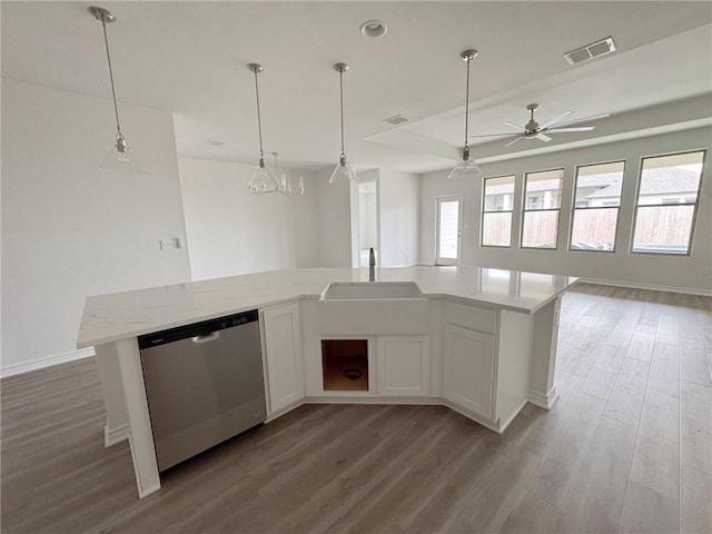 kitchen with a center island with sink, stainless steel dishwasher, white cabinets, and light hardwood / wood-style floors