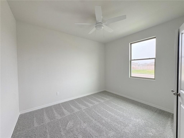 carpeted empty room with ceiling fan