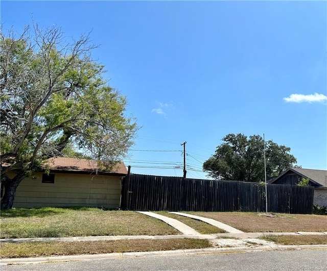 view of property exterior featuring a lawn