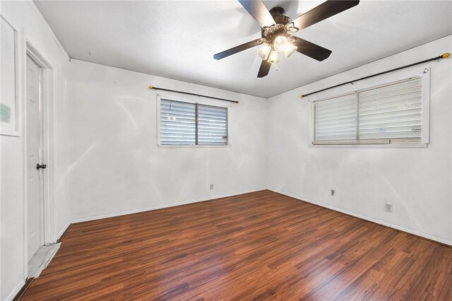 3718 Brushwood, Corpus Christi, TX 78415 - unfurnished bedroom with wood finished floors, ceiling fan, and baseboards