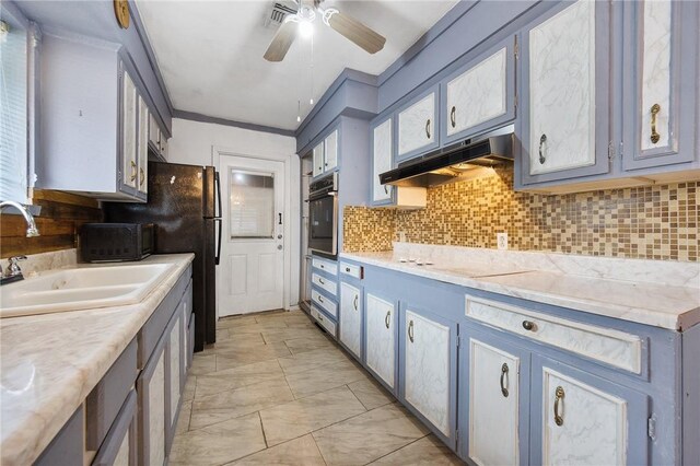 3718 Brushwood, Corpus Christi, TX 78415 - kitchen featuring stainless steel oven, under cabinet range hood, a sink, white stovetop, and light countertops
