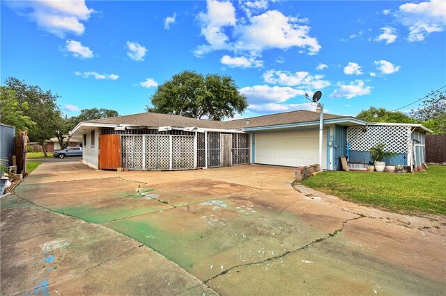 3718 Brushwood, Corpus Christi, TX 78415 - view of front of property featuring a garage, concrete driveway, and a front yard