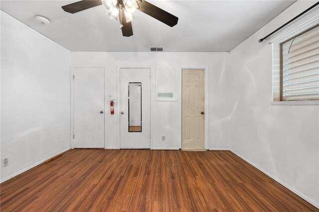 3718 Brushwood, Corpus Christi, TX 78415 - unfurnished bedroom with wood finished floors, baseboards, and a ceiling fan