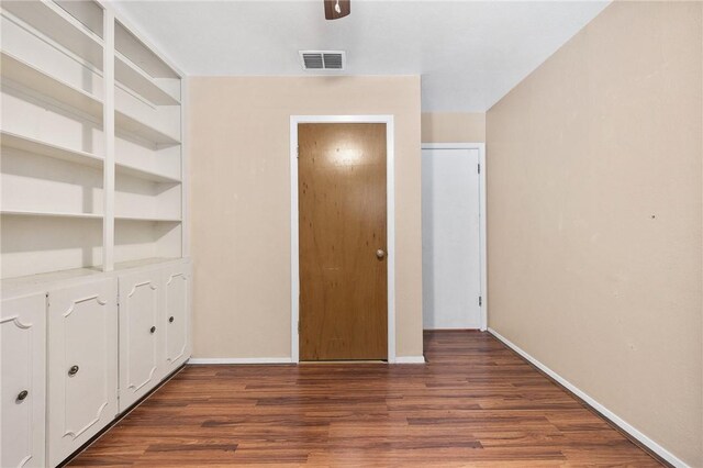 3718 Brushwood, Corpus Christi, TX 78415 - unfurnished bedroom with wood finished floors, baseboards, and ceiling fan