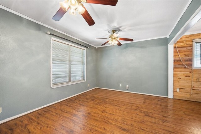 3718 Brushwood, Corpus Christi, TX 78415 - spare room with a ceiling fan, crown molding, wood finished floors, wood walls, and baseboards