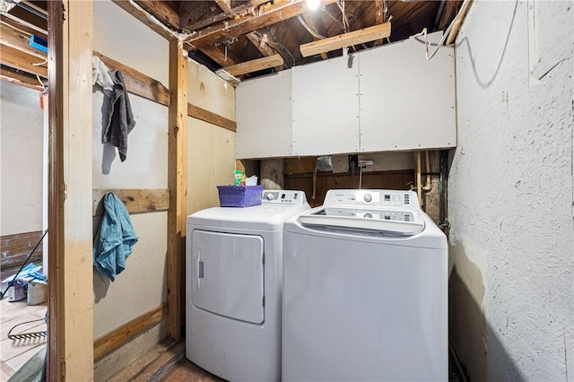 laundry room with cabinet space and washer and dryer