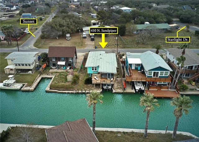 drone / aerial view featuring a residential view and a water view