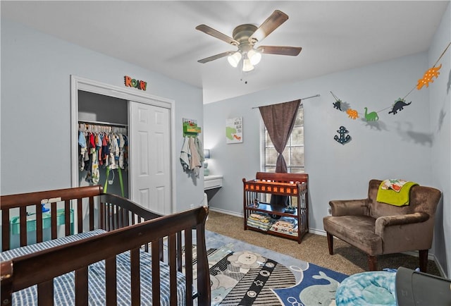 carpeted bedroom featuring a closet, a ceiling fan, and baseboards