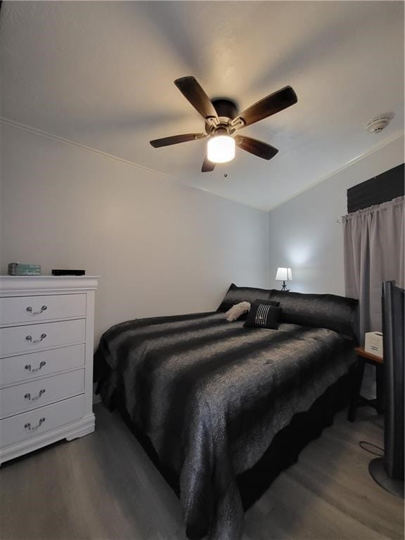 bedroom with ceiling fan and dark hardwood / wood-style flooring