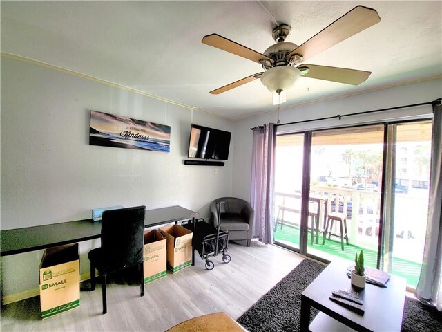 office area with ceiling fan, hardwood / wood-style floors, and ornamental molding