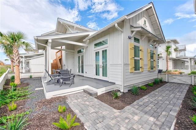 rear view of property featuring french doors