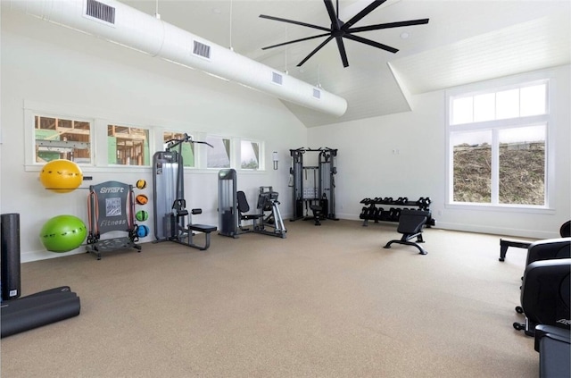 workout room with ceiling fan, carpet flooring, and a healthy amount of sunlight