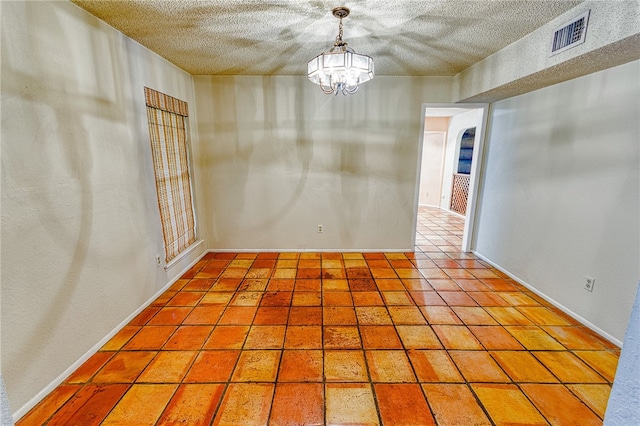 4513 Greensboro Dr, Corpus Christi, TX 78413 - spare room with a textured ceiling and a chandelier