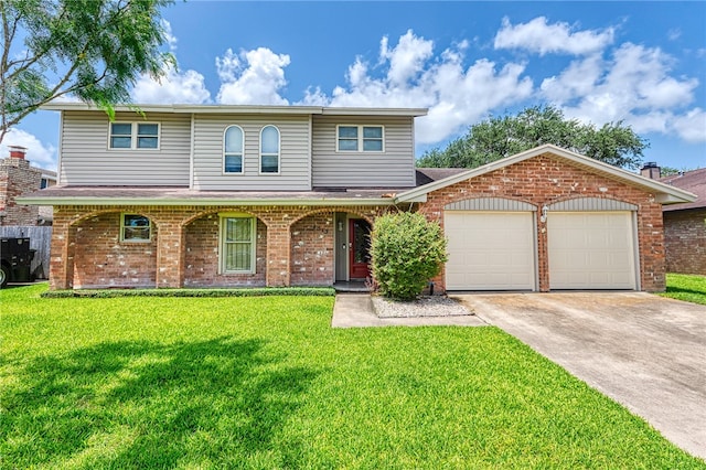 4513 Greensboro Dr, Corpus Christi, TX 78413 - view of front facade featuring an attached garage, brick siding, a front yard, and driveway