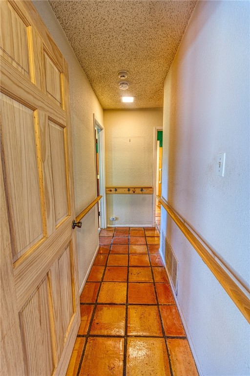 4513 Greensboro Dr, Corpus Christi, TX 78413 - hall featuring a textured wall