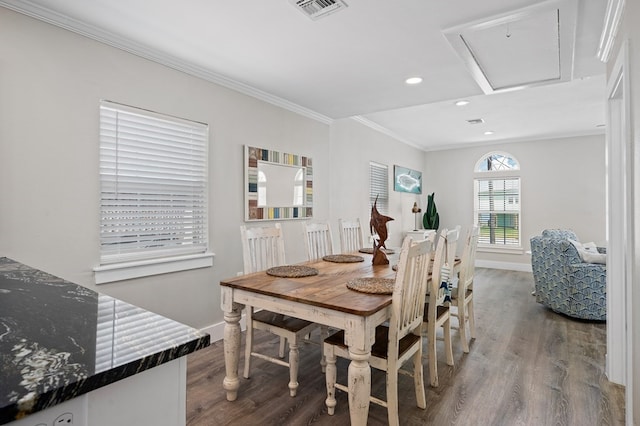 dining space featuring hardwood / wood-style flooring and ornamental molding