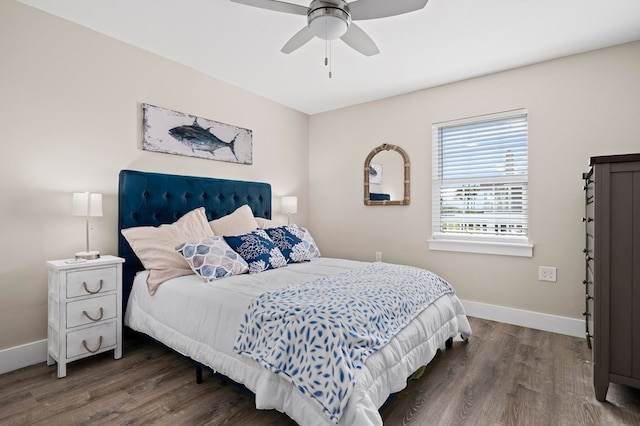 bedroom featuring ceiling fan and dark wood-type flooring