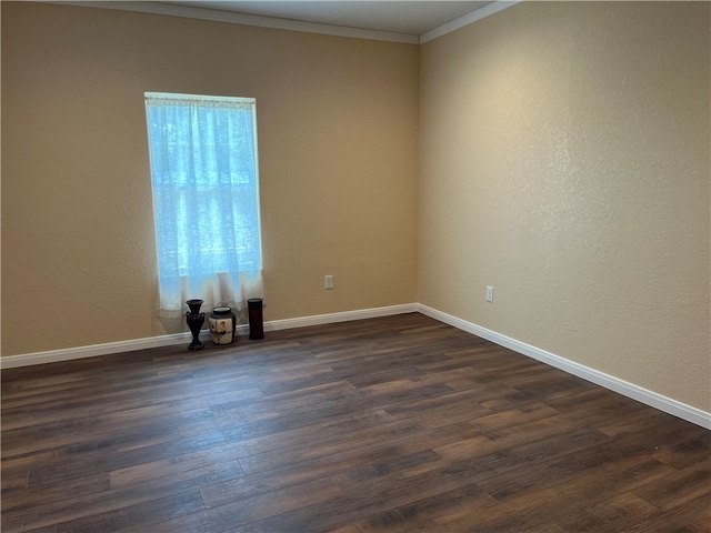 unfurnished room with dark wood-type flooring and ornamental molding